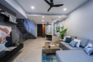 After home staging: the same living room, staged with a sofa and rug