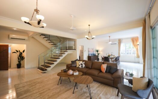 Staged living room with rugs in a landed home